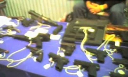 The grainy video of an illicit automatic weapon sale was taken at the Phoenix gun show by undercover New York cops.
