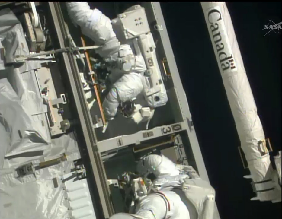 NASA astronauts Rick Mastracchio (right) and Steve Swanson work outside the International Space Station to replace a dead computer during a spacewalk on April 23, 2014.