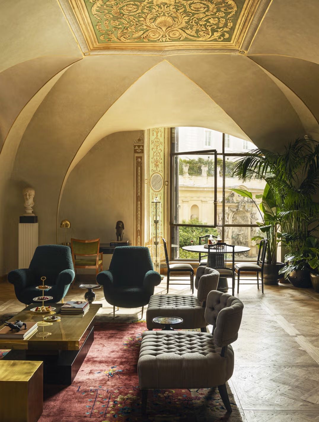An old, renaissance-style palazzo is reinvented as a contemporary hotel, with plush furnishings and artefacts.