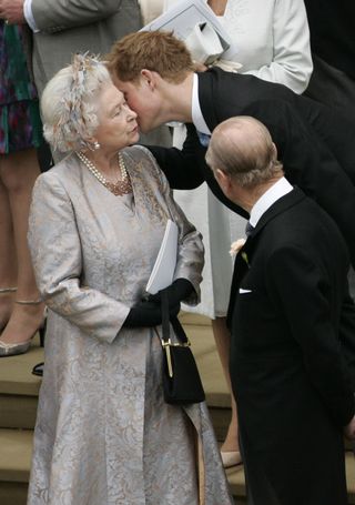 Queen Elizabeth and Prince Harry interacting