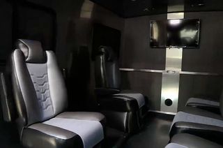 The interior of the Astrovan II features custom-upholstered bucket-style seats, a high-definition television and the ability to livestream the crew's trip out to the Starliner launchpad.