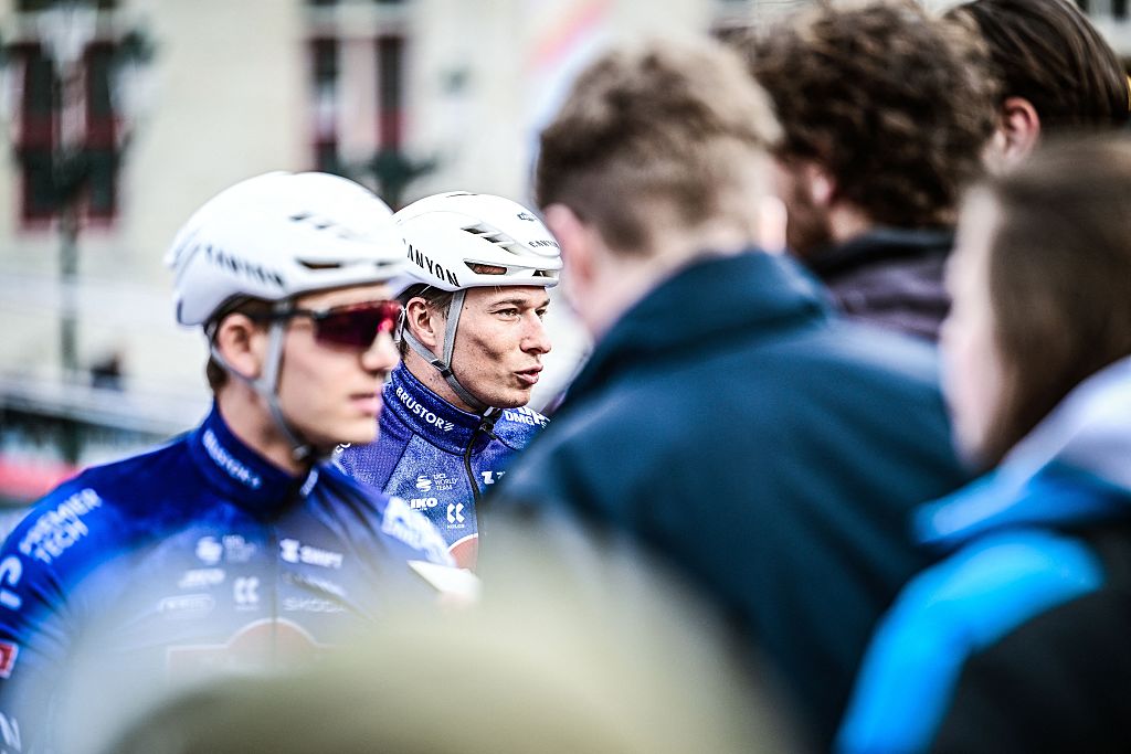 Alpecin-Premier Tech's Belgian rider Jasper Philipsen discusses at the start of the 'Ronde van Brugge' men's elite one-day cycling race, 202,9 km from and to Bruges on March 25, 2026. (Photo by MAARTEN STRAETEMANS / Belga / AFP) / Belgium OUT
