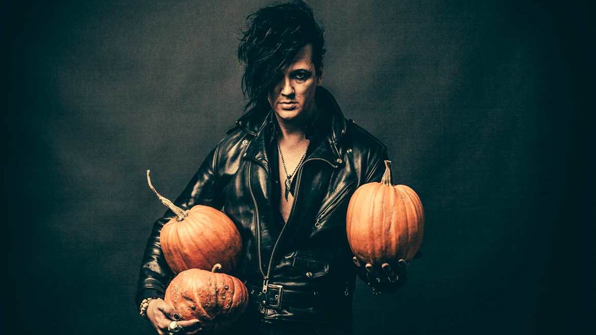 The 69 Eyes singer Jyrki 69 holding Halloween pumpkins