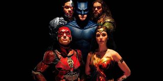 Justice League lineup, minus Superman, in the dark