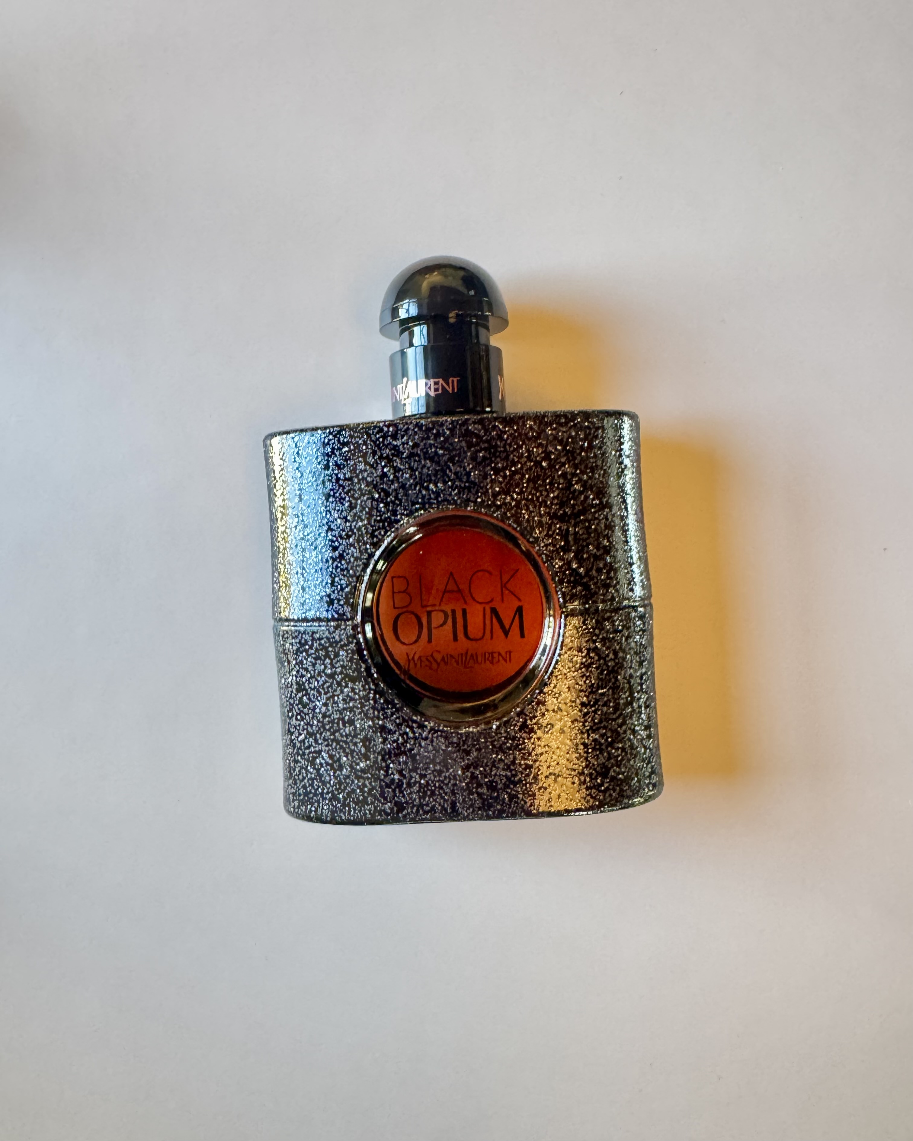 A bottle of YSL's Black Opium EDP.