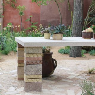 Garden table with succulents in pots