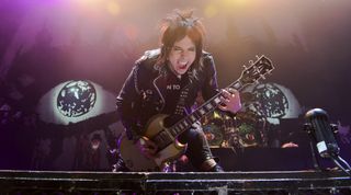 Tommy Henriksen performs with Alice Cooper at the Moda Center in Portland, Oregon on December 15, 2015