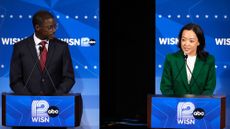 Democratic gubernatorial candidate Francesca Hong, right, talks as David Crowley listens during a primary debate in Milwaukee.