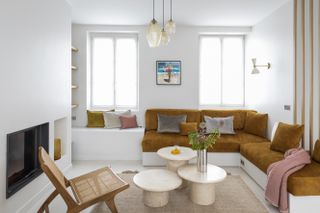 white living room with built-in sofa bench