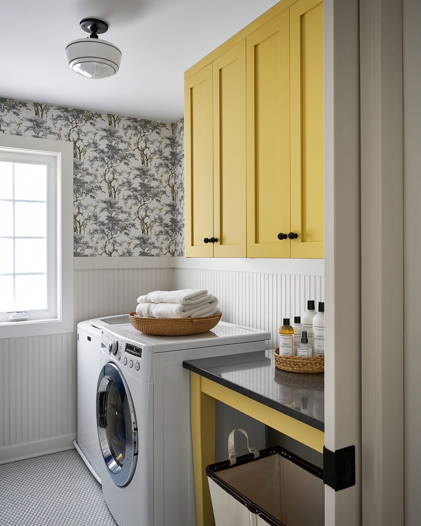 Ikea laundry room hack yellow cabinets by Semihandmade