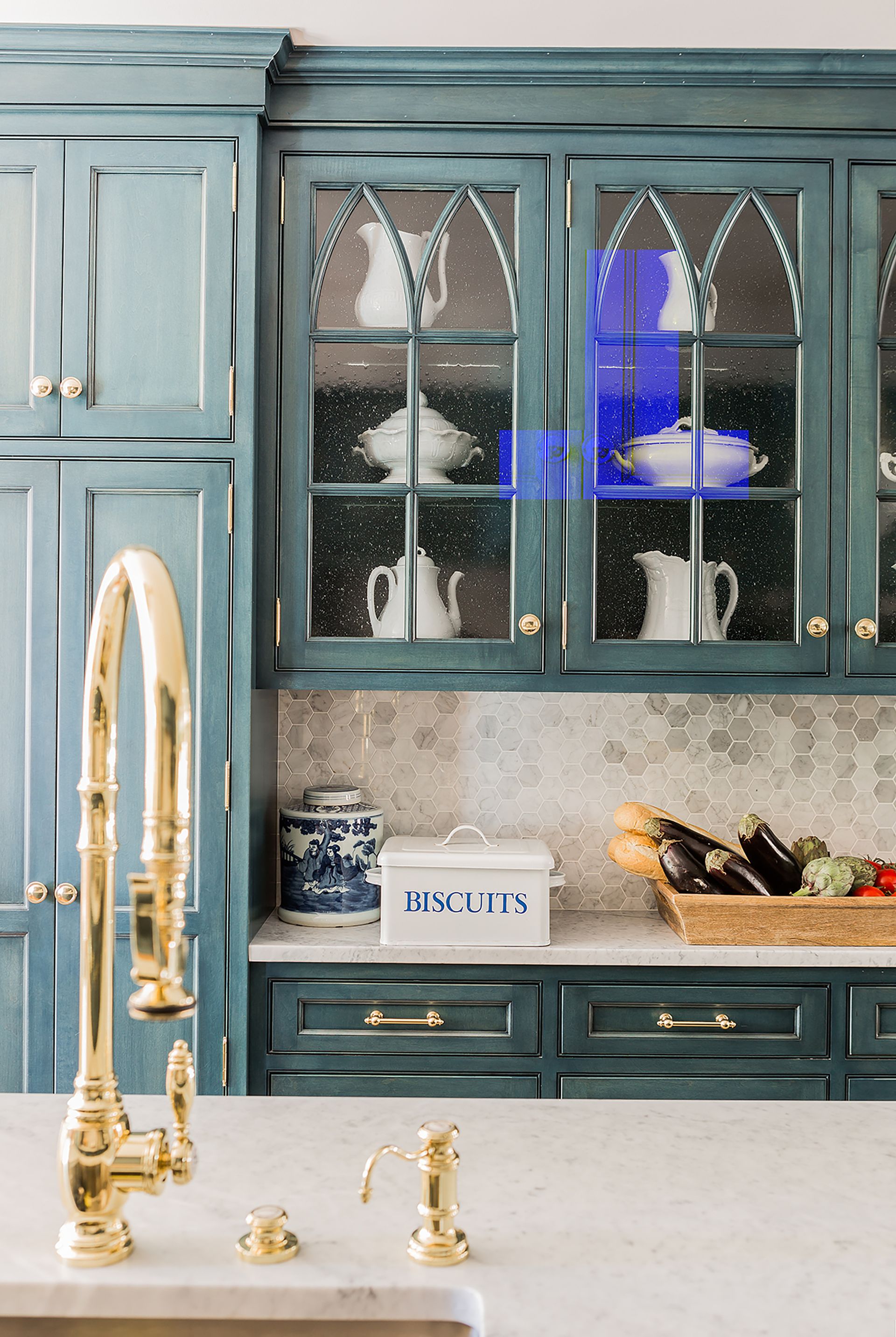 kitchen with distressed teal cabinetry and brass tap and sink K. Marshall Design