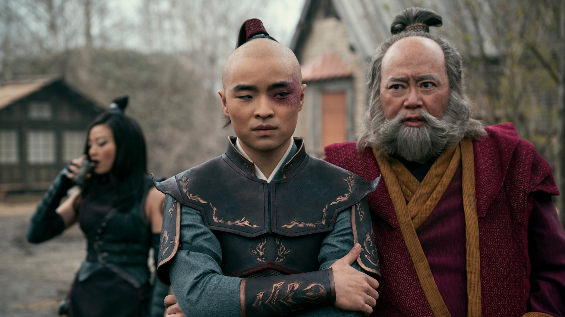 Zuko folds his arms angrily as Azula looks away in the background of Avatar: The Last Airbender