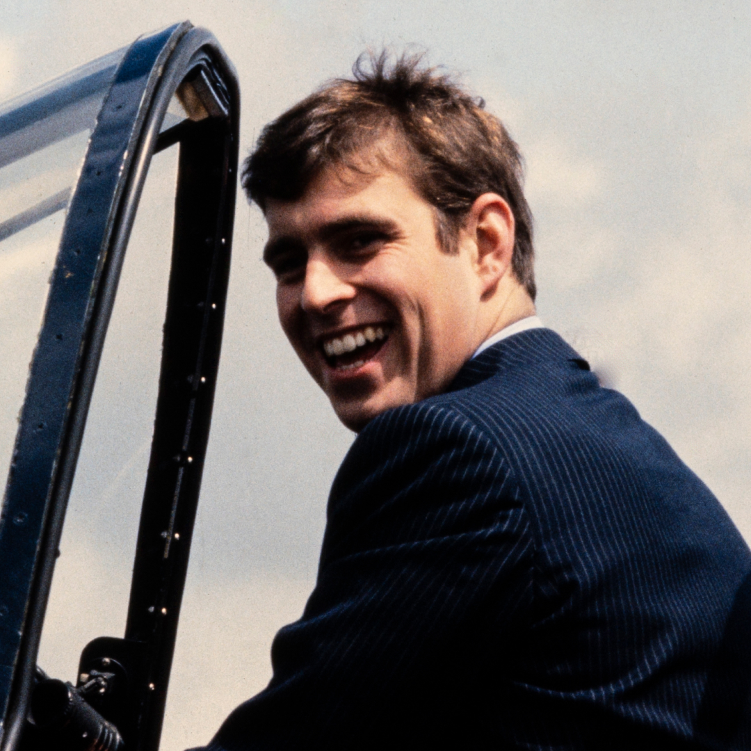 Prince Andrew laughing in a plane
