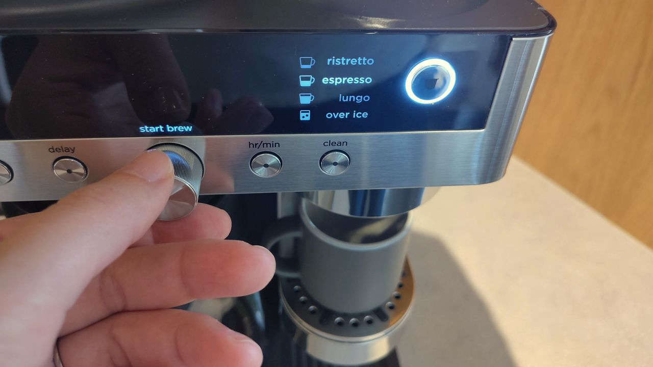 Person adjusting brew settings for espresso on Ninja Prestige Dual-Brew System