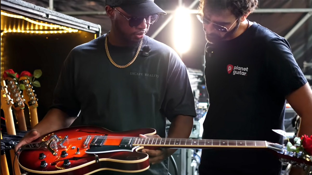 Chris Payton shows Planet Guitar his Collings I-35, a gift from Bruno Mars