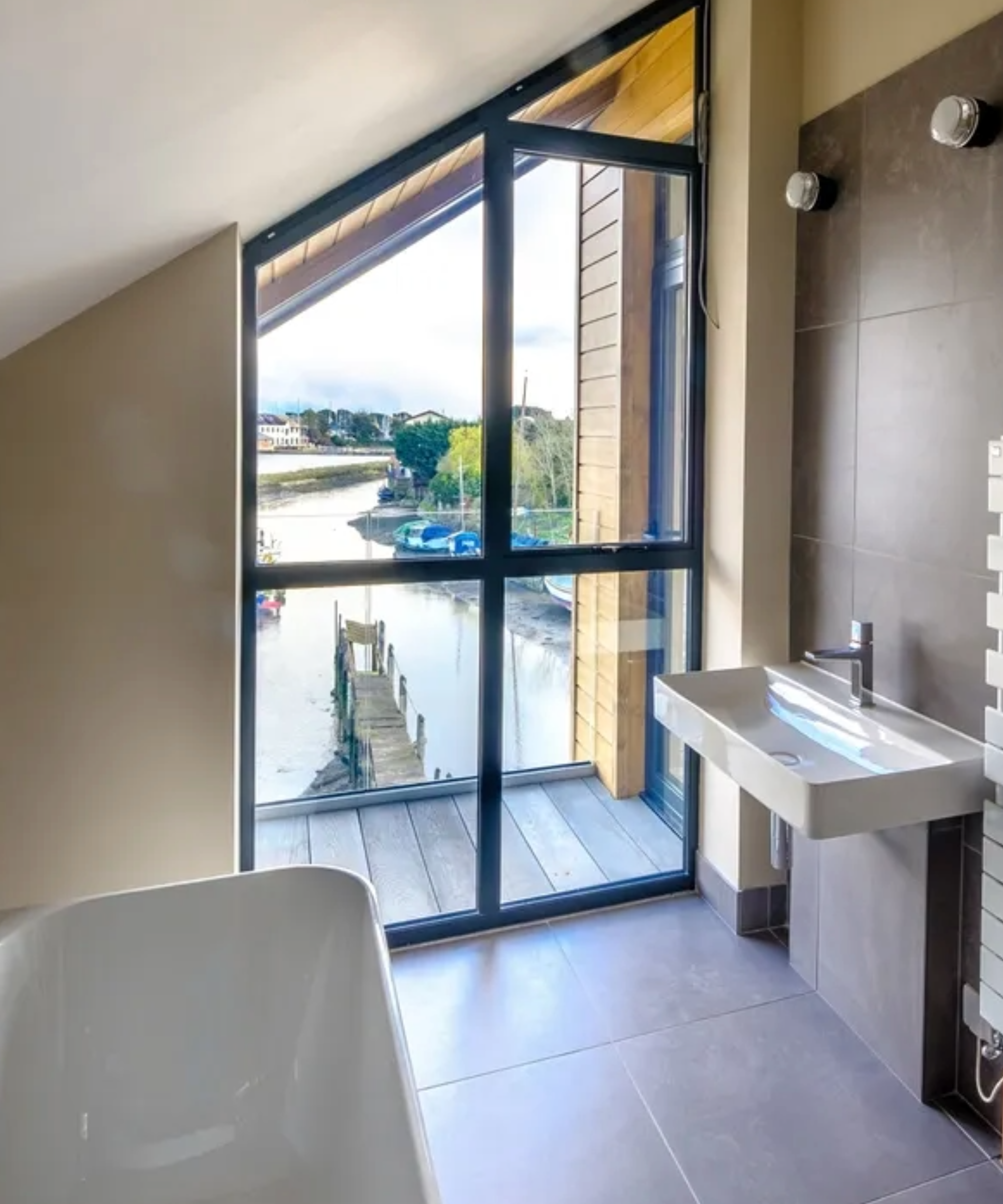 a bathroom with a pitched window