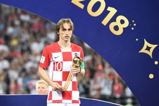 Luka Modric holds his award for the 2018 World Cup's best player after Croatia's defeat to France in the final in Moscow.