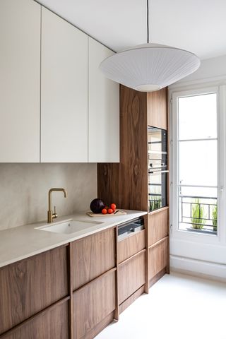 contemporary kitchen with walnut cabinetry and trim