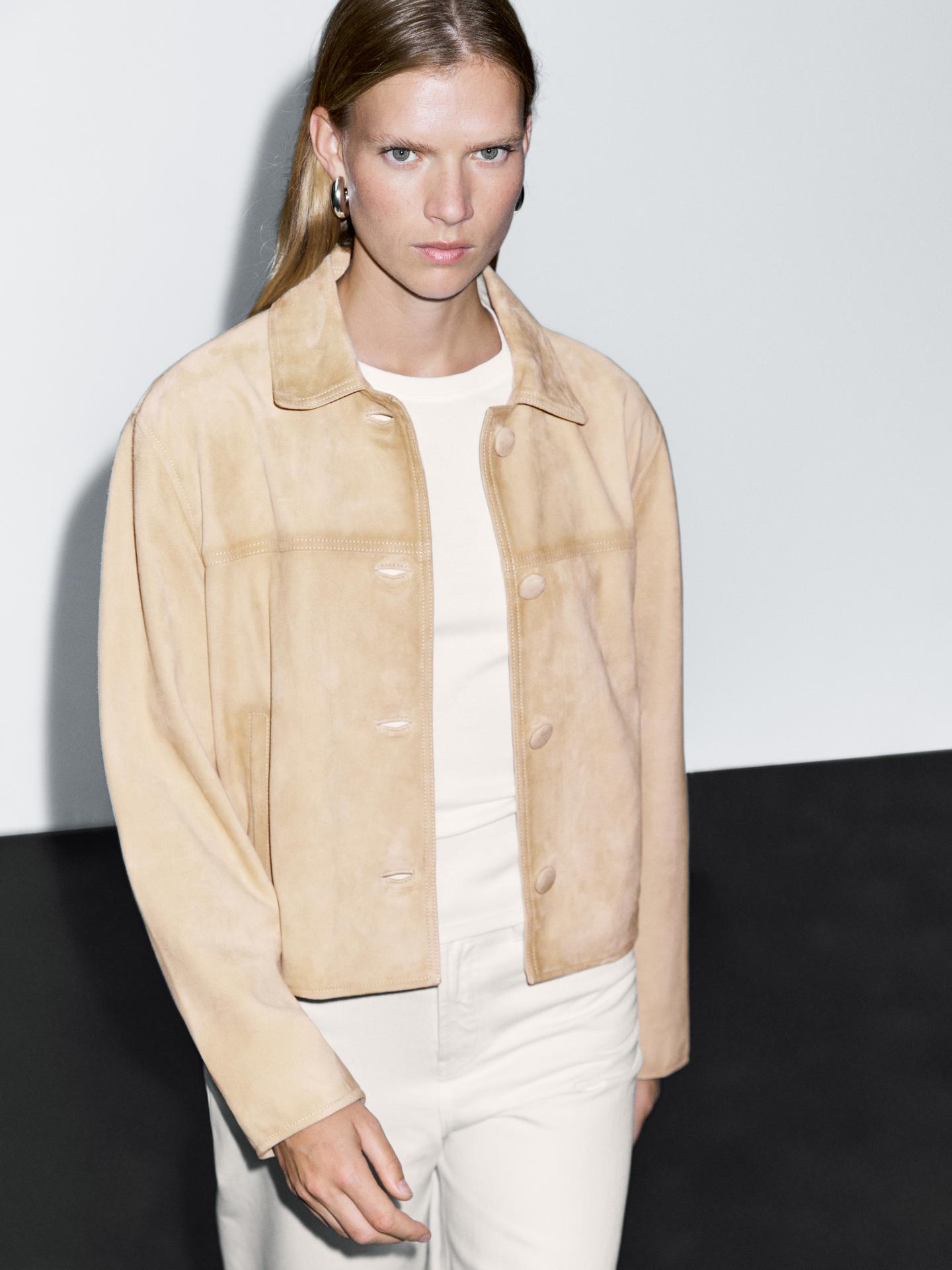 A model wears a short suede leather jacket 