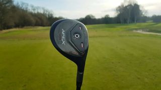 Callaway Apex UW showing off its black clubhead design on the golf course