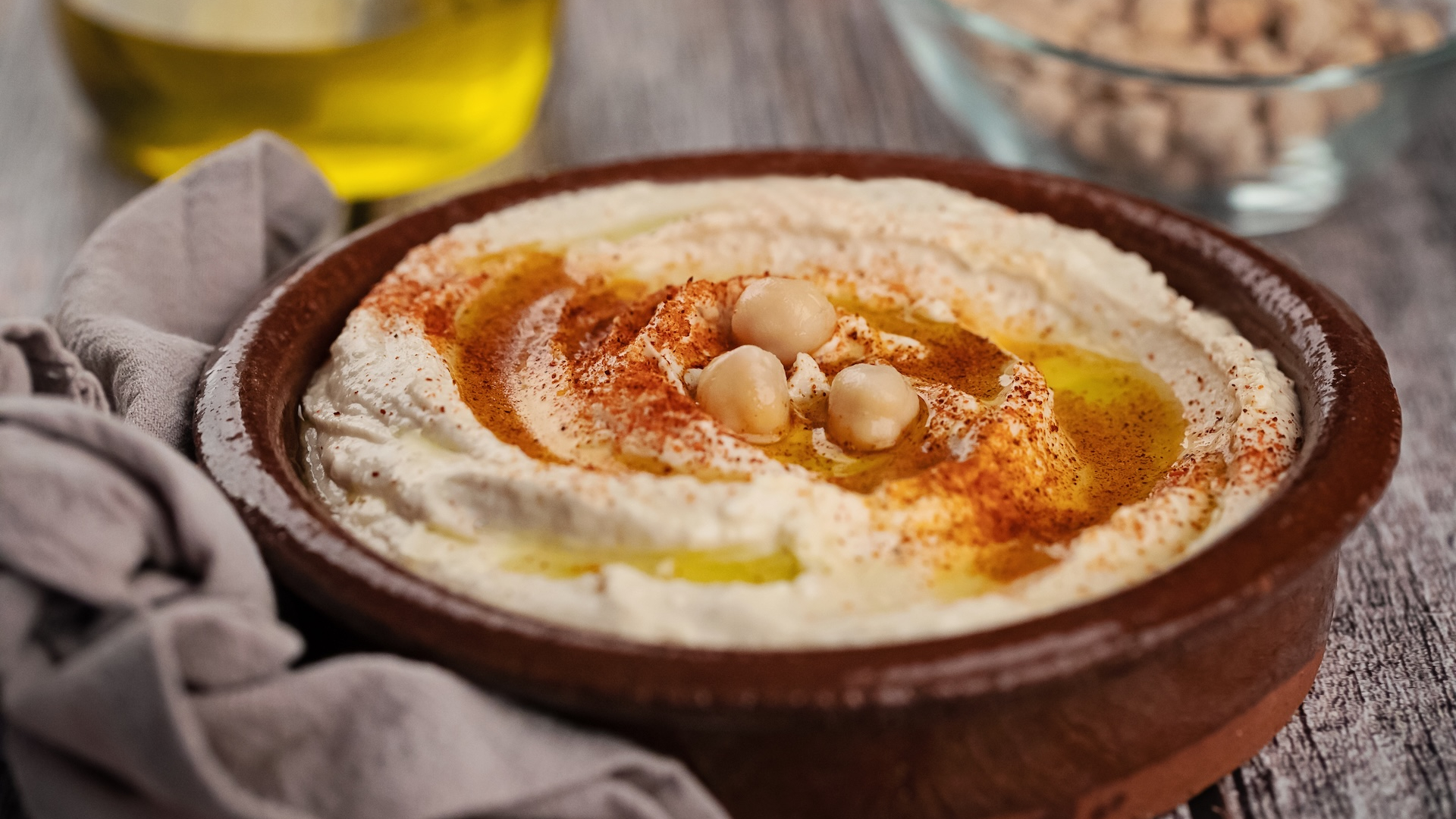 High angle view of hummus on wooden surface