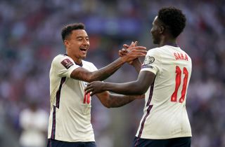 Jesse Lingard (left) celebrates with Bukayo Saka