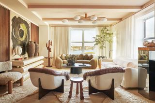 a living room with vintage armchairs