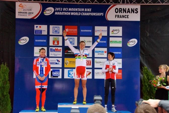 Annika Langvad atop the marathon Worlds podium in 2012
