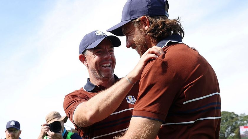 Rory McIlroy and Tommy Fleetwood, of Europe, celebrate winning a point for their team at the Ryder Cup 2025