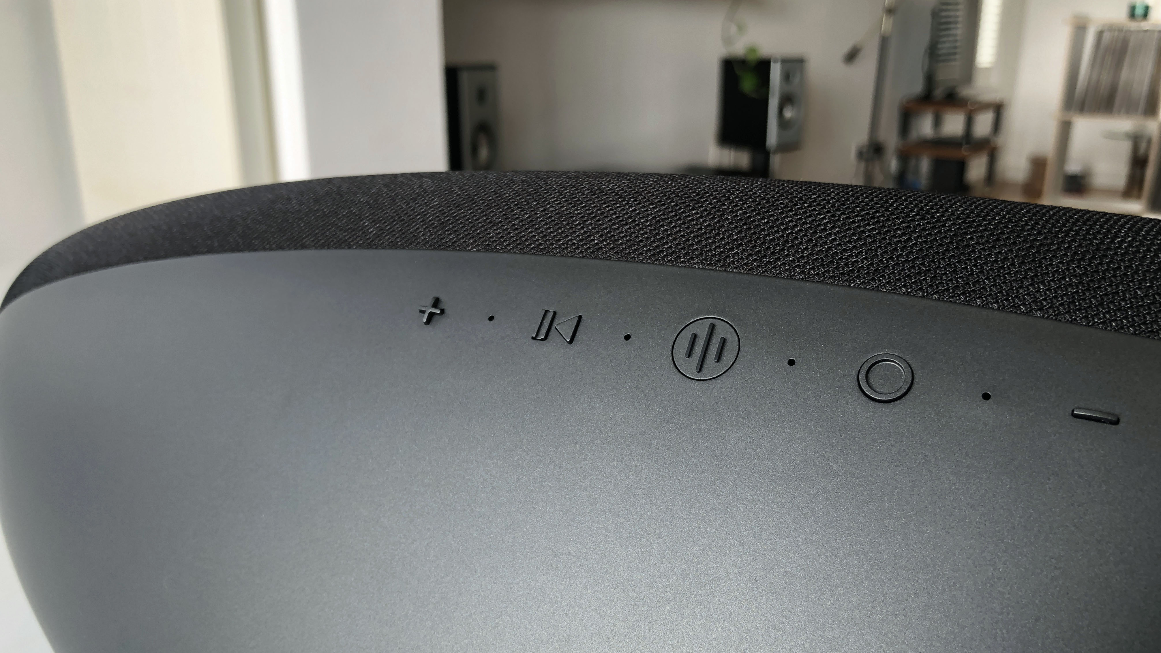 a closeup of the buttons on the bowers & wilkins zeppelin wireless speaker