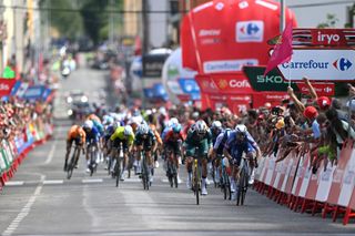 VILLABLINO SPAIN AUGUST 31 LR Wout van Aert of Belgium and Team Visma Lease a Bike Green Points Jersey and stage winner Kaden Groves of Australia and Team Alpecin Deceuninck sprint at finish line during the La Vuelta 79th Tour of Spain 2024 Stage 14 a 2005km stage from Villafranco del Bierzo to Villablino UCIWT on August 31 2024 in Villablino Spain Photo by Dario BelingheriGetty Images