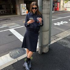 Closed-up image of @poppyalmond wears toggle trainers.