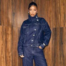A model wearing a matching high-neck denim jacket and jeans from EGO.
