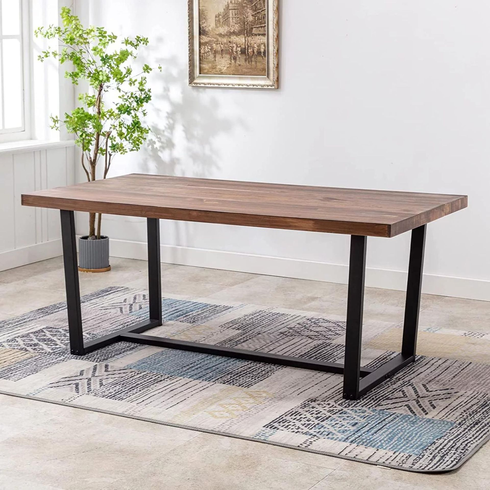 Walmart Solid Wood Dining Table against a white wall.