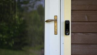 Vivint Doorbell by door on wooden home