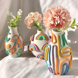 Eclectic, playful bud vases in assorted designs with tactile finish