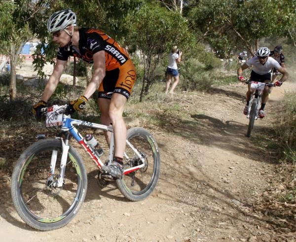 Dan McConnell at the top of the course, win Sid Taberlay chasing
