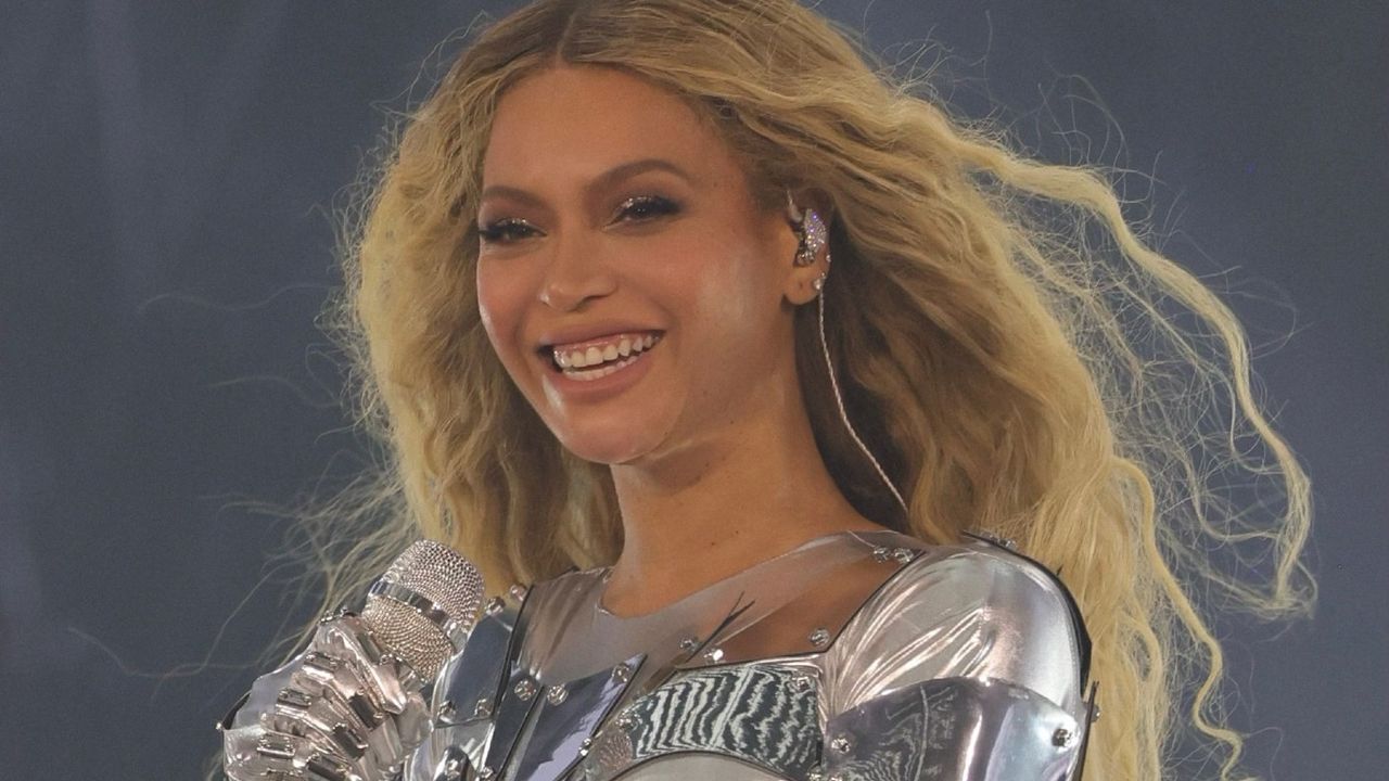 Beyonce performing in a silver bodysuit