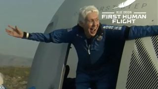 Aviator Wally Funk emerging from the New Shepard capsule after Blue Origin's first flight with a human crew.