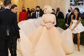 Singer Billie Eilish arriving at the Met Gala wearing a gorgeous Oscar de la Renta gown