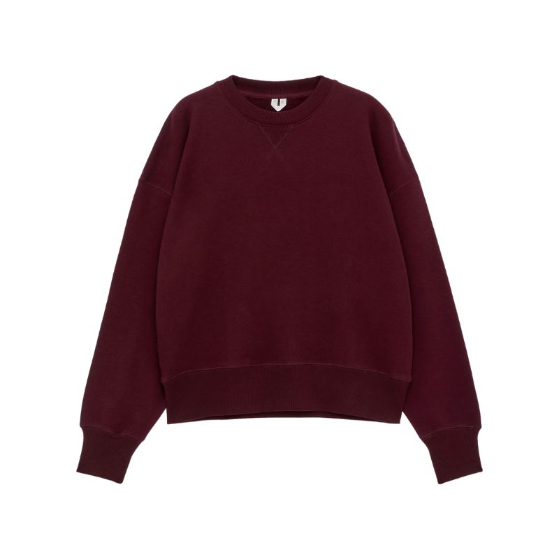 A cutout of a burgundy ARKET oversized sweatshirt