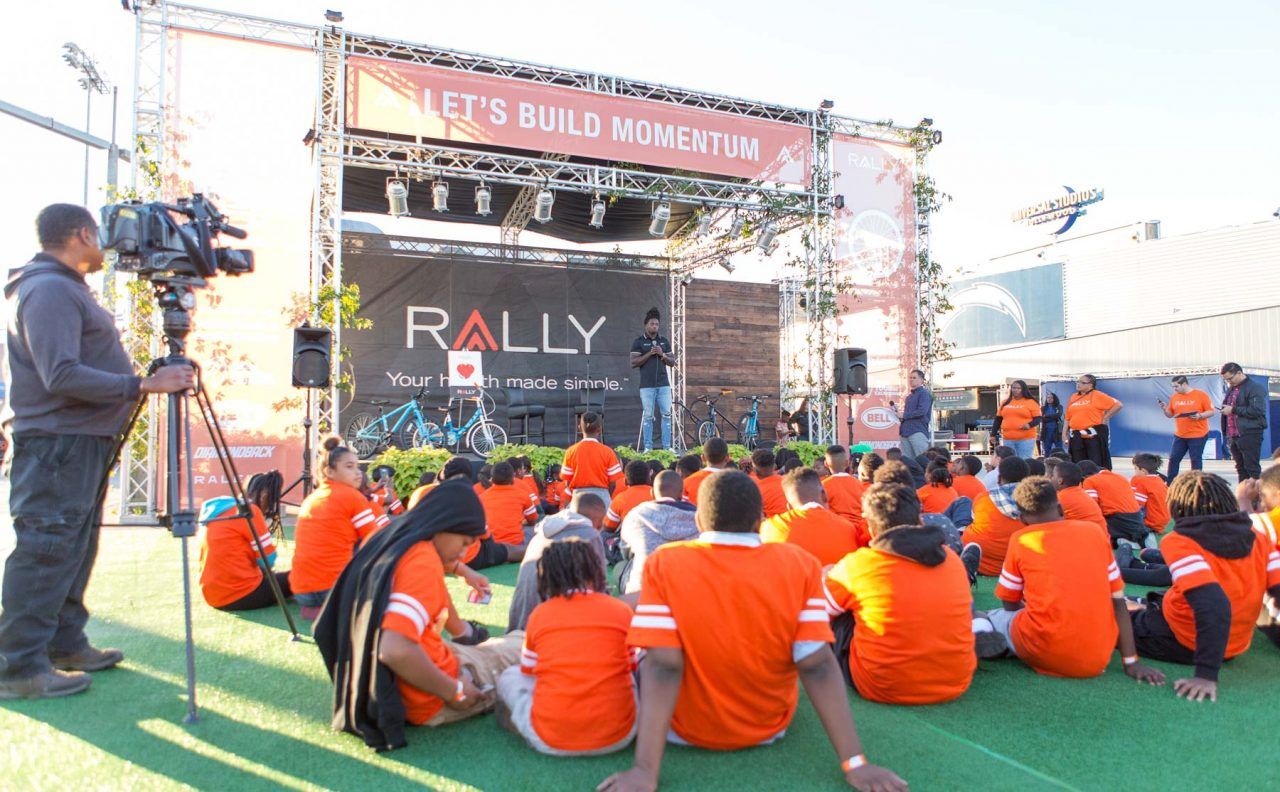 Melvin Gordon addresses the children during the bike build at the StubHub Center
