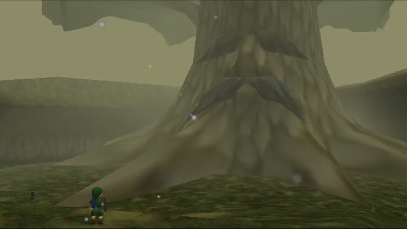 A small elf boy stands in front of a huge tree