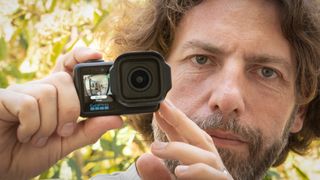 Adam Juniper holding a GoPro Mission 1 Pro camera