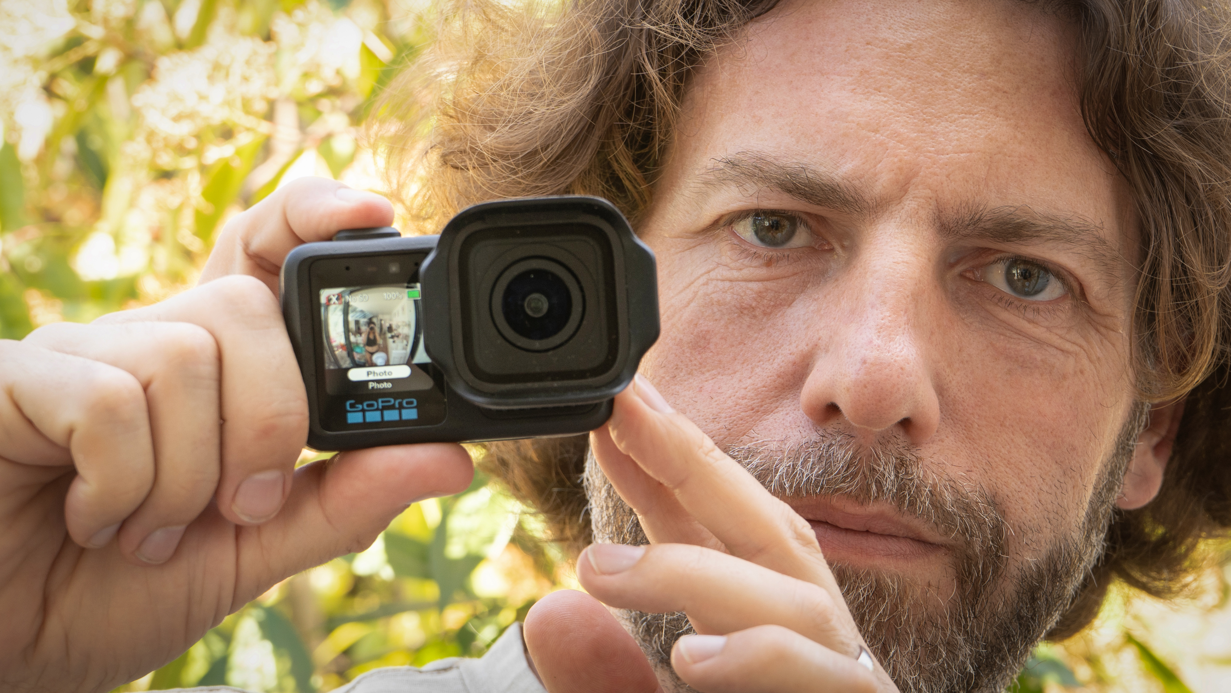 Adam Juniper holding a GoPro Mission 1 Pro camera