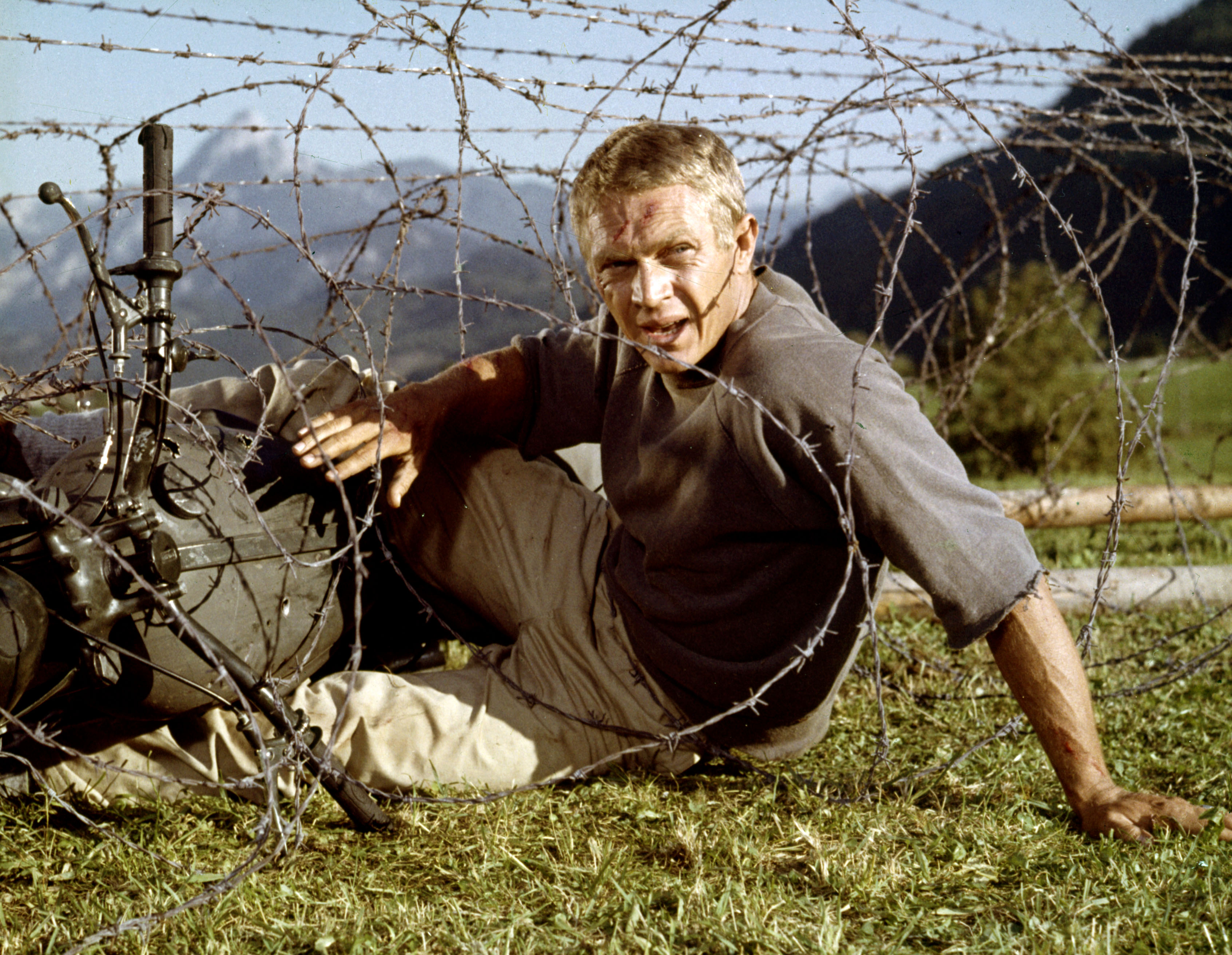 Steve McQueen struggles through barbed wire in The Great Escape