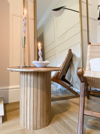 A wooden reed effect side table