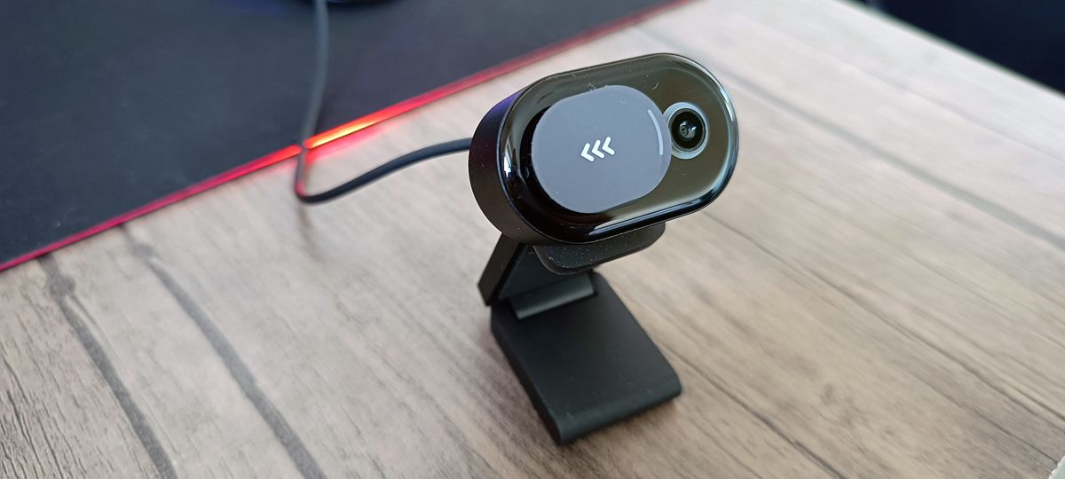 A black Microsoft Modern Webcam sitting on a desk