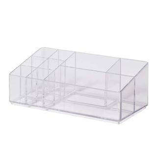 A plastic slotted cosmetic organizer