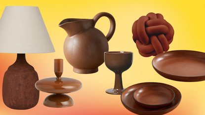 brown lamp, pitcher, candlestick, wine glass, pillow and round trays